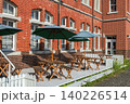 Outdoor patio of cafe seat by brick building at Mojiko town, Kitakyushu 140226514
