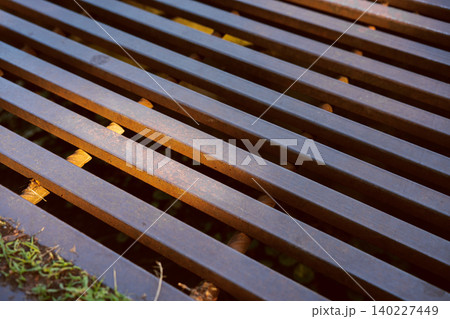 Industrial metal grate pattern with rusty iron bars and linear geometric structure background 140227449