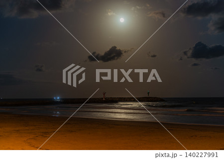 Full Moon Over Calm Nighttime Beach Waters Full Moon Over Calm Nighttime Beach Waters 140227991