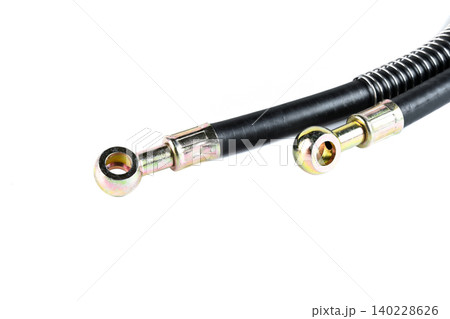 Motorcycle oil cooler pressure hoses with steel banjo fittings close up. 140228626