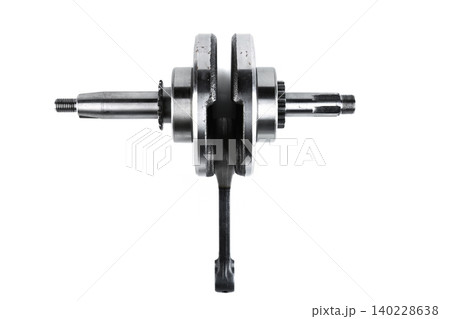 Motorcycle engine steel crankshaft with connecting rod isolated on white background. Motorcycle engine steel crankshaft with connecting rod isolated on white background. 140228638