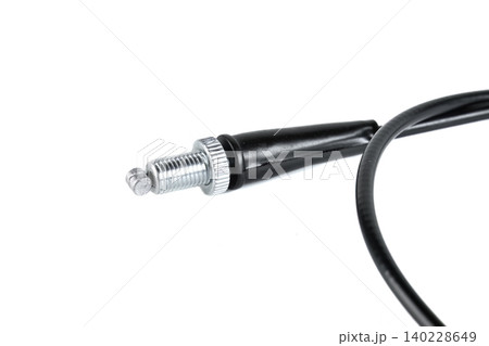 Motorcycle throttle cable barrel adjuster with knurled lock nut close up. Motorcycle throttle cable barrel adjuster with knurled lock nut close up. 140228649