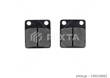 Motorcycle disc brake pad set with friction lining and steel backing plate top view. 140228662