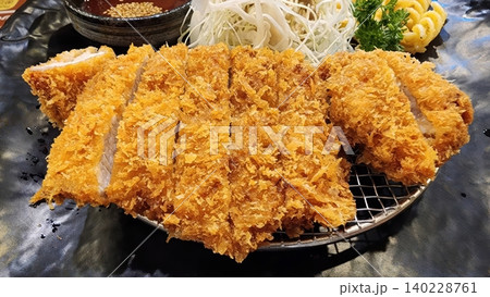 Crispy Japanese Tonkatsu Fried Pork Cutlet Served with Shredded Cabbage 140228761