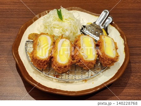 Japanese Deep Fried Pork Cutlet with Cheese Filling served with Cabbage 140228768