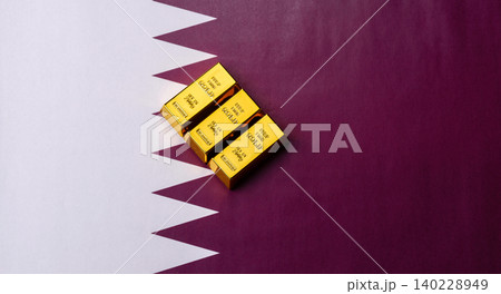 Qatari gold bars or ingots as a tool for balance, financial investment. Qatari gold bars 140228949