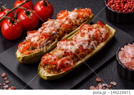 Baked zucchini half with minced meat, tomatoes, cheese, salt, and spices. Zucchini with minced meat Baked zucchini half with minced meat, tomatoes, cheese, salt, and spices. Zucchini with minced meat 140228971