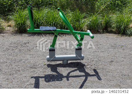 Outdoor fitness trainer machine in public park 140231452