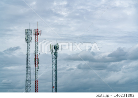 Telecommunication tower with white cloudy sky. Antenna. Radio and satellite pole. Communication technology. Telecommunication industry. Mobile or telecom 5g network. Telecommunication industry. Telecommunication tower with white cloudy sky. Antenna. Radio and satellite pole. Communication technology. Telecommunication industry. Mobile or telecom 5g network. Telecommunication industry. 140231892