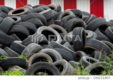 Pile of used tires. Old tyres waste for recycle or for landfill. Black rubber tire of car. Pile of used tires at recycling manufacturing yard. Material for landfill. Pile of second hand tires for sale Pile of used tires. Old tyres waste for recycle or for landfill. Black rubber tire of car. Pile of used tires at recycling manufacturing yard. Material for landfill. Pile of second hand tires for sale 140231907