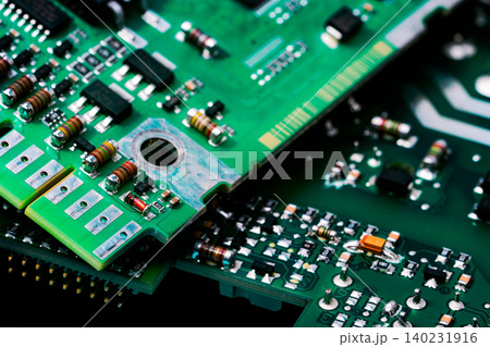 Electronic circuit board. Semiconductor motherboard circuit board technology. Mainboard of computer. Integrated semiconductor microchip on green circuit board. Hi-tech industry and computer science. Electronic circuit board. Semiconductor motherboard circuit board technology. Mainboard of computer. Integrated semiconductor microchip on green circuit board. Hi-tech industry and computer science. 140231916
