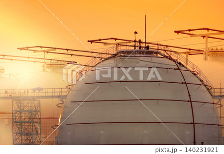 Industrial gas storage tank. LNG or liquefied natural gas storage tank. Round gas tank in petroleum refinery. Natural gas storage industry and global market consumption. Global energy crisis concept. Industrial gas storage tank. LNG or liquefied natural gas storage tank. Round gas tank in petroleum refinery. Natural gas storage industry and global market consumption. Global energy crisis concept. 140231921