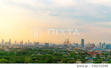 Cityscape of modern building with highway and community in Bangkok. Car driving on elevated bridge. Skyscraper building. Green trees in city. Oxygen for urban life. Eco-friendly city. Urban skyline. Cityscape of modern building with highway and community in Bangkok. Car driving on elevated bridge. Skyscraper building. Green trees in city. Oxygen for urban life. Eco-friendly city. Urban skyline. 140232046