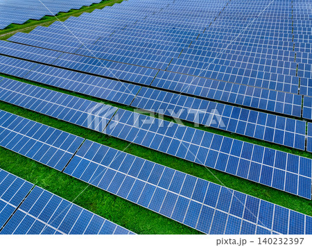 Aerial view of solar farm. Sustainable renewable energy and modern photovoltaic technology for eco-friendly electricity production. Solar power station. Green energy solutions. Solar panel technology. Aerial view of solar farm. Sustainable renewable energy and modern photovoltaic technology for eco-friendly electricity production. Solar power station. Green energy solutions. Solar panel technology. 140232397