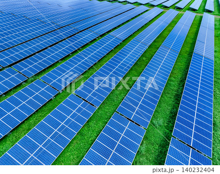 Aerial view of solar farm. Sustainable renewable energy and modern photovoltaic technology for eco-friendly electricity production. Solar power station. Green energy solutions. Solar panel technology. Aerial view of solar farm. Sustainable renewable energy and modern photovoltaic technology for eco-friendly electricity production. Solar power station. Green energy solutions. Solar panel technology. 140232404