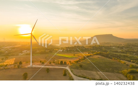 Wind farm field and sunset sky. Wind power. Sustainable, renewable energy. Wind turbines generate electricity. Sustainable development. Green technology for energy sustainability. Eco-friendly energy. Wind farm field and sunset sky. Wind power. Sustainable, renewable energy. Wind turbines generate electricity. Sustainable development. Green technology for energy sustainability. Eco-friendly energy. 140232438