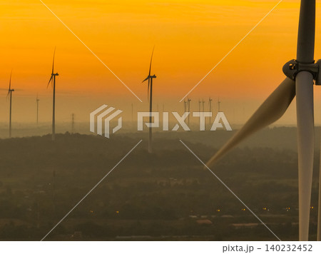 Wind farm field and sunset sky. Wind power. Sustainable, renewable energy. Wind turbines generate electricity. Sustainable development. Green technology for energy sustainability. Eco-friendly energy. Wind farm field and sunset sky. Wind power. Sustainable, renewable energy. Wind turbines generate electricity. Sustainable development. Green technology for energy sustainability. Eco-friendly energy. 140232452