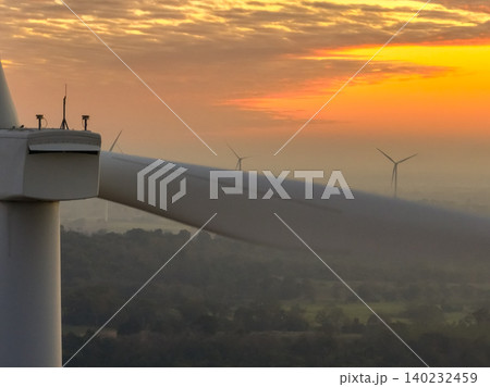 Wind farm field and sunset sky. Wind power. Sustainable, renewable energy. Wind turbines generate electricity. Sustainable development. Green technology for energy sustainability. Eco-friendly energy. Wind farm field and sunset sky. Wind power. Sustainable, renewable energy. Wind turbines generate electricity. Sustainable development. Green technology for energy sustainability. Eco-friendly energy. 140232459