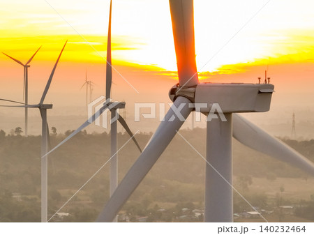 Wind farm field and sunset sky. Wind power. Sustainable, renewable energy. Wind turbines generate electricity. Sustainable development. Green technology for energy sustainability. Eco-friendly energy. Wind farm field and sunset sky. Wind power. Sustainable, renewable energy. Wind turbines generate electricity. Sustainable development. Green technology for energy sustainability. Eco-friendly energy. 140232464