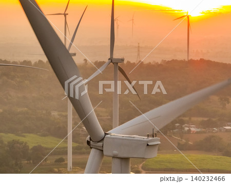 Wind farm field and sunset sky. Wind power. Sustainable, renewable energy. Wind turbines generate electricity. Sustainable development. Green technology for energy sustainability. Eco-friendly energy. Wind farm field and sunset sky. Wind power. Sustainable, renewable energy. Wind turbines generate electricity. Sustainable development. Green technology for energy sustainability. Eco-friendly energy. 140232466
