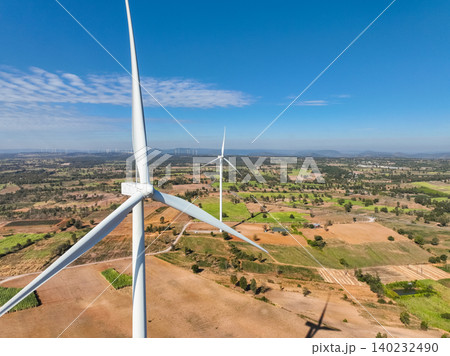 Wind energy and sustainable power generation with wind turbines, Eco-friendly solutions for renewable resources. Wind power farm and sustainable development of renewable energy, green technology. 140232490
