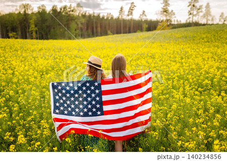 4th of July. Independence Day. Patriotic holiday. USA flag fluttering in the wind. 140234856