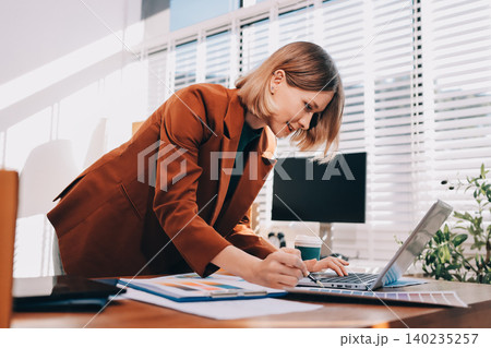 Fashion designer woman and typing on laptop in shop for email project or online order of fabric in creative startup Serious tailor computer and small business for clothes or textile in : Generative AI Fashion designer woman and typing on laptop in shop for email project or online order of fabric in creative startup Serious tailor computer and small business for clothes or textile in : Generative AI 140235257