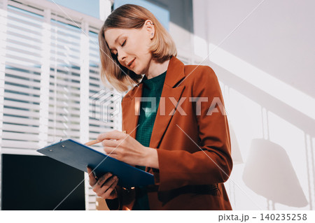 Fashion designer woman and typing on laptop in shop for email project or online order of fabric in creative startup Serious tailor computer and small business for clothes or textile in : Generative AI 140235258