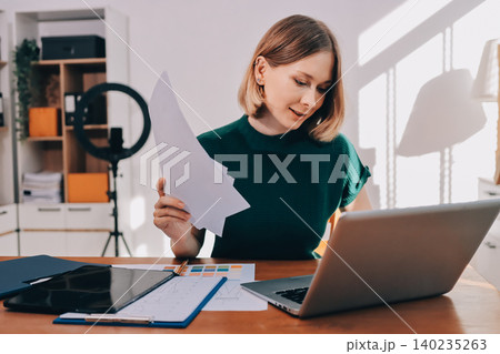 Fashion designer woman and typing on laptop in shop for email project or online order of fabric in creative startup Serious tailor computer and small business for clothes or textile in : Generative AI 140235263