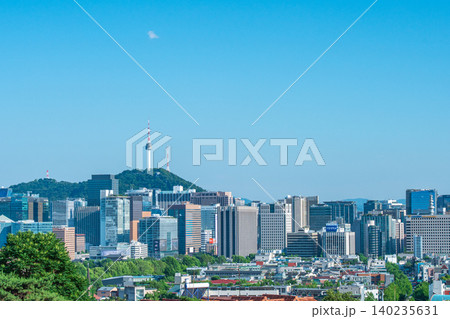Seoul, South Korea - June. 05, 2026 : Scenic view of Namsan Seoul Tower towering over downtown skyscrapers on a clear summer day in Seoul, South Korea 140235631