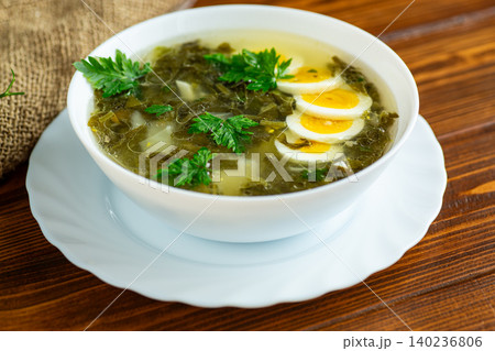 Homemade sorrel soup served in white bowl Homemade sorrel soup served in white bowl 140236806