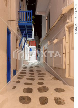 Narrow street with balconies in Mykonos, Greece at night 140237595