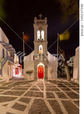 Church with bell tower in Mykonos, Greece at night 140237596