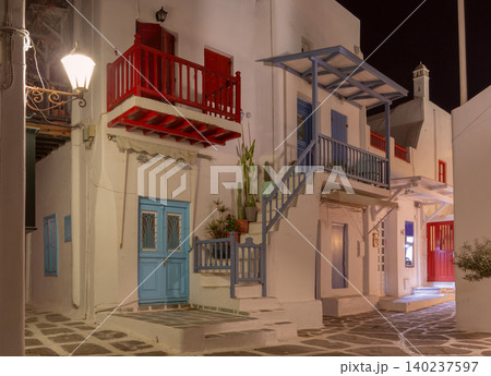 Narrow street with balconies in Mykonos, Greece at night 140237597