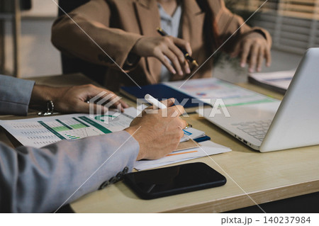 Business accounting concept, Business man using calculator with computer laptop, budget and loan paper in office. Business accounting concept, Business man using calculator with computer laptop, budget and loan paper in office. 140237984