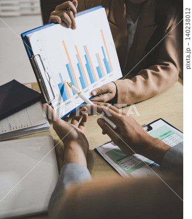 Business accounting concept, Business man using calculator with computer laptop, budget and loan paper in office. 140238012
