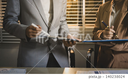 Business accounting concept, Business man using calculator with computer laptop, budget and loan paper in office. Business accounting concept, Business man using calculator with computer laptop, budget and loan paper in office. 140238024