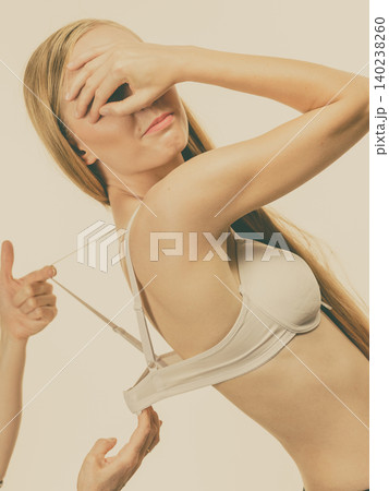 Woman wearing too big bra Woman wearing too big bra 140238260