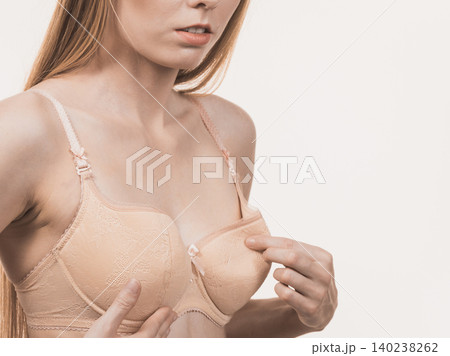 Girl wearing too big bra cup 140238262