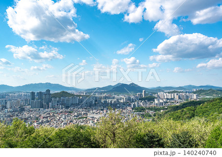 Panoramic view of downtown Seoul city skyline from Yongmasan mountain observatory on a clear spring afternoon Panoramic view of downtown Seoul city skyline from Yongmasan mountain observatory on a clear spring afternoon 140240740