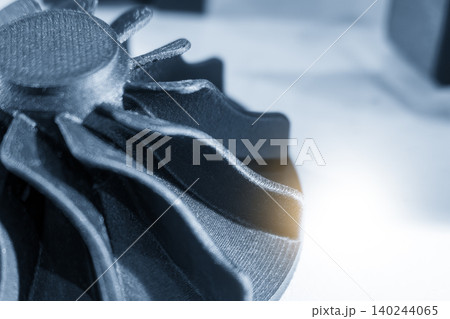 Close-up of functional sample parts created by advanced 3D printing method in a blue tone scene. 140244065
