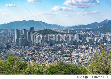Panoramic view of downtown Seoul city skyline from Yongmasan mountain observatory on a clear spring afternoon Panoramic view of downtown Seoul city skyline from Yongmasan mountain observatory on a clear spring afternoon 140244124