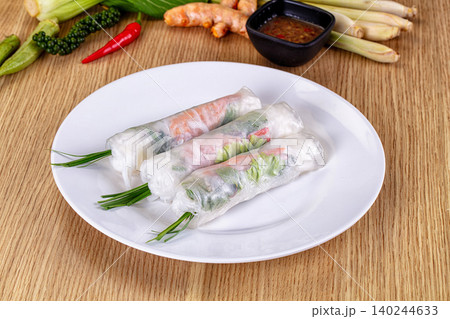 Vietnamese fresh spring rolls with shrimp and vegetables on white plate Vietnamese fresh spring rolls with shrimp and vegetables on white plate 140244633