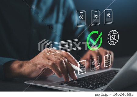 Professional hand laptop iso certification document approval quality control compliance management international standard assurance business process validates digital audit records efficiently 140246683