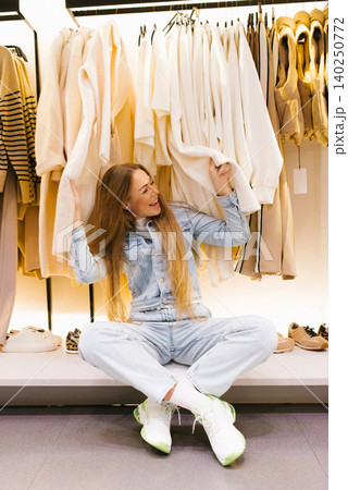 Cheerful Woman Having Fun while Shopping Store Cheerful Woman Having Fun while Shopping Store 140250772