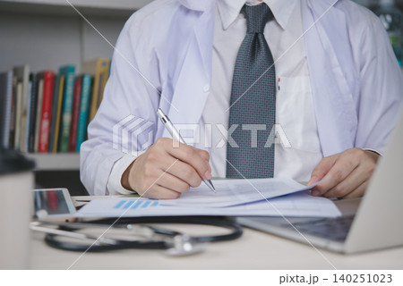 Doctor, medical Healthcare professional checks charts and fills forms at a clinic workstation to maintain EHR,EMR, ensure compliance, and streamline patient care. concept record keeping and quality. Doctor, medical Healthcare professional checks charts and fills forms at a clinic workstation to maintain EHR,EMR, ensure compliance, and streamline patient care. concept record keeping and quality. 140251023