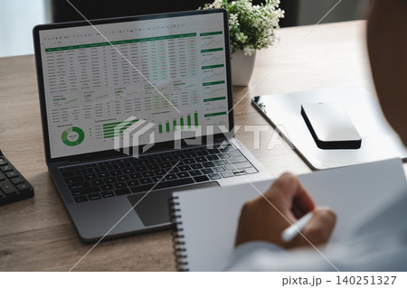 Person reviewing online analysis dashboard and spreadsheet data on a laptop, monitoring business performance metrics, financial reports and data driven decision making workflow. Person reviewing online analysis dashboard and spreadsheet data on a laptop, monitoring business performance metrics, financial reports and data driven decision making workflow. 140251327