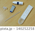 HIV Self Testing Kit on Wooden Surface test strip tube plastic medical device clinical home health neutral 140252258