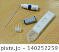 HIV Self Testing Kit on Wooden Table plastic white blue clear pipette health medical diagnosis disease 140252259