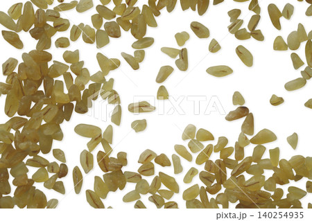 Bulgur wheat groats scattered top view flat lay Bulgur wheat groats scattered top view flat lay 140254935